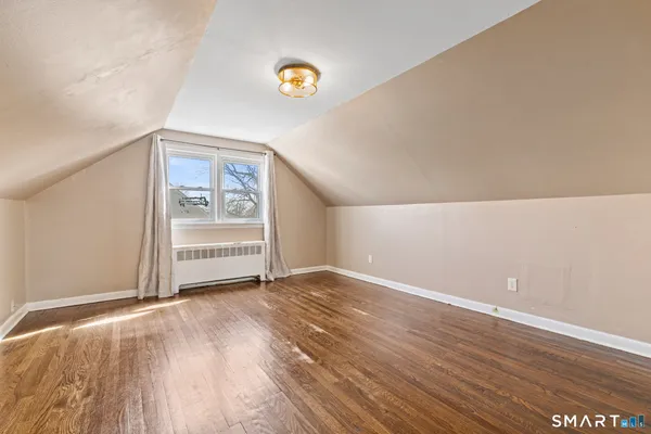 a view of a livingroom with wooden floor
