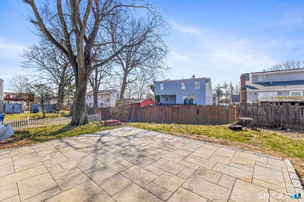 a view of a backyard of the house