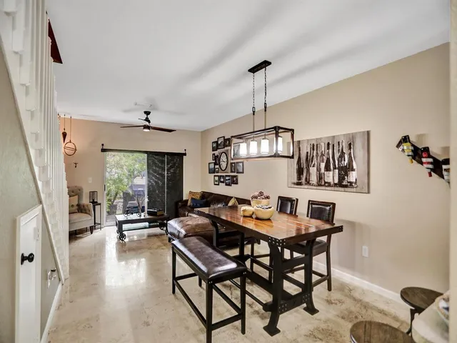 a view of a livingroom with furniture window and wooden floor