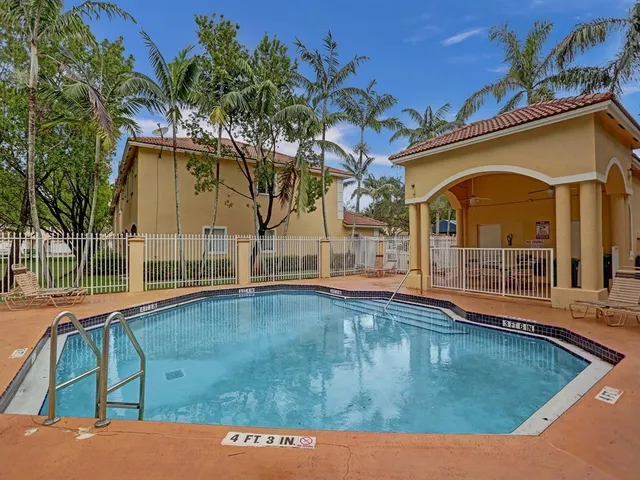 a view of a house with swimming pool