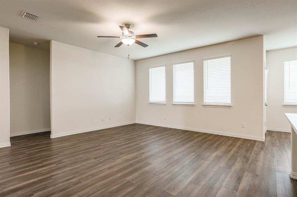 652 Ridgeback Trail Fort Worth, TX 76052 - Photo 20 of 20 Unfurnished room with dark wood-type flooring and ceiling fan