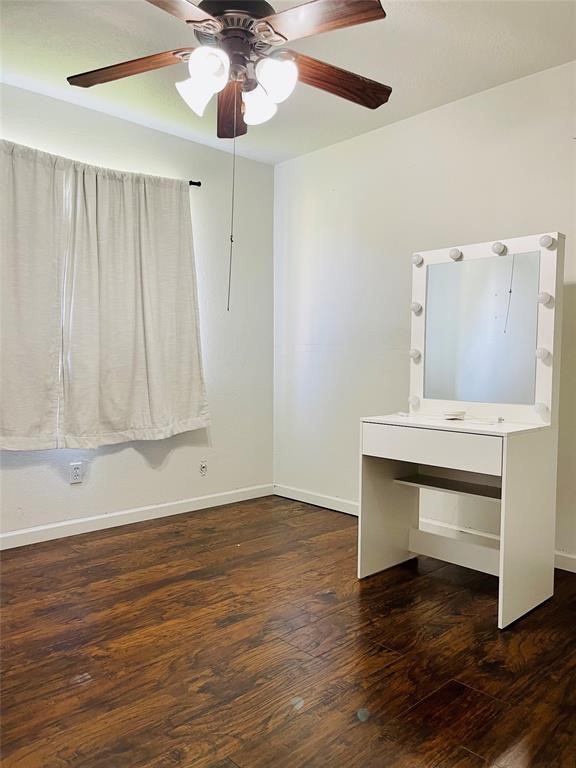17002 Dew Drop Lane Houston, TX 77095 - Photo 12 of 14 a view of room with wooden floor and ceiling fan