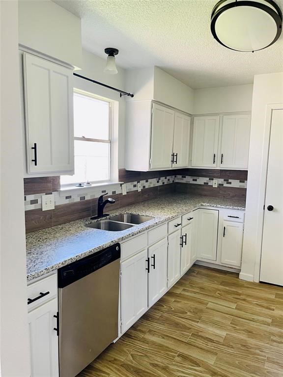 17002 Dew Drop Lane Houston, TX 77095 - Photo 5 of 14 a kitchen with granite countertop white cabinets and white appliances