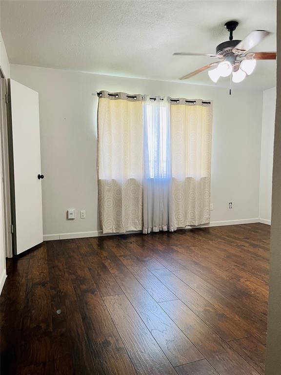 17002 Dew Drop Lane Houston, TX 77095 - Photo 10 of 14 wooden floor in an empty room with a window