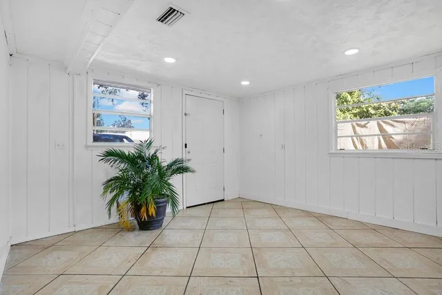 a view of an empty room with a window