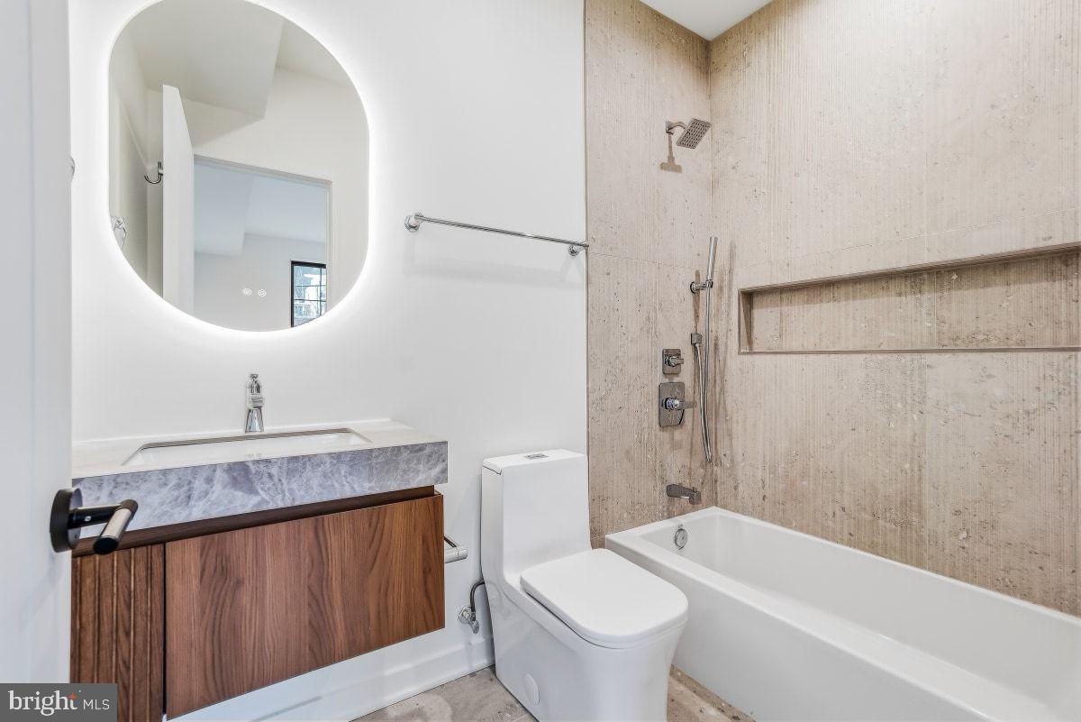 3554 T Street Northwest Washington, DC 20007 - Photo 32 of 57 a bathroom with a granite countertop sink mirror toilet and bathtub