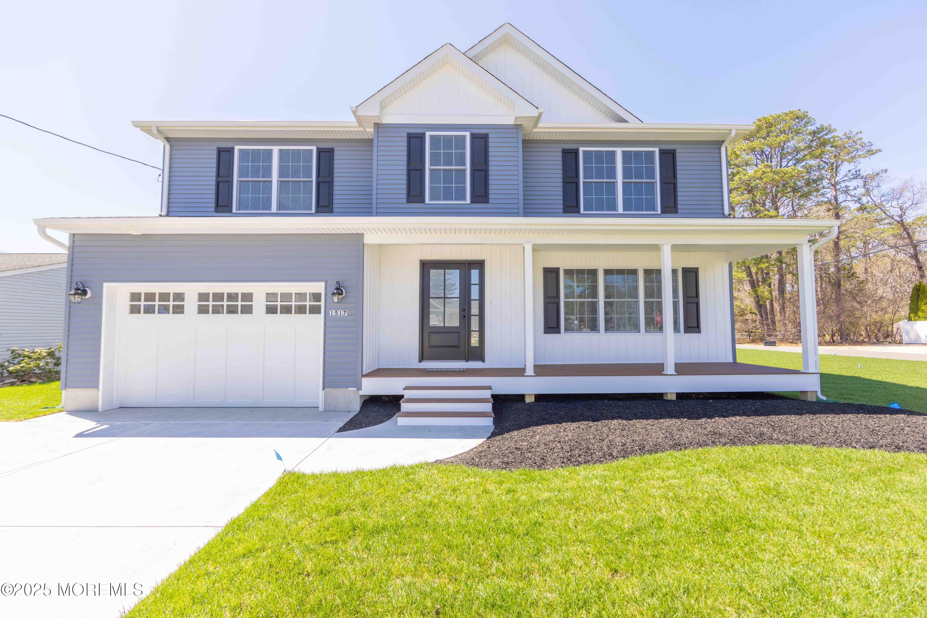 1517 Whitcomb Road Forked River, NJ 08731 - Photo 1 of 18 a front view of a house with a garden and swimming pool