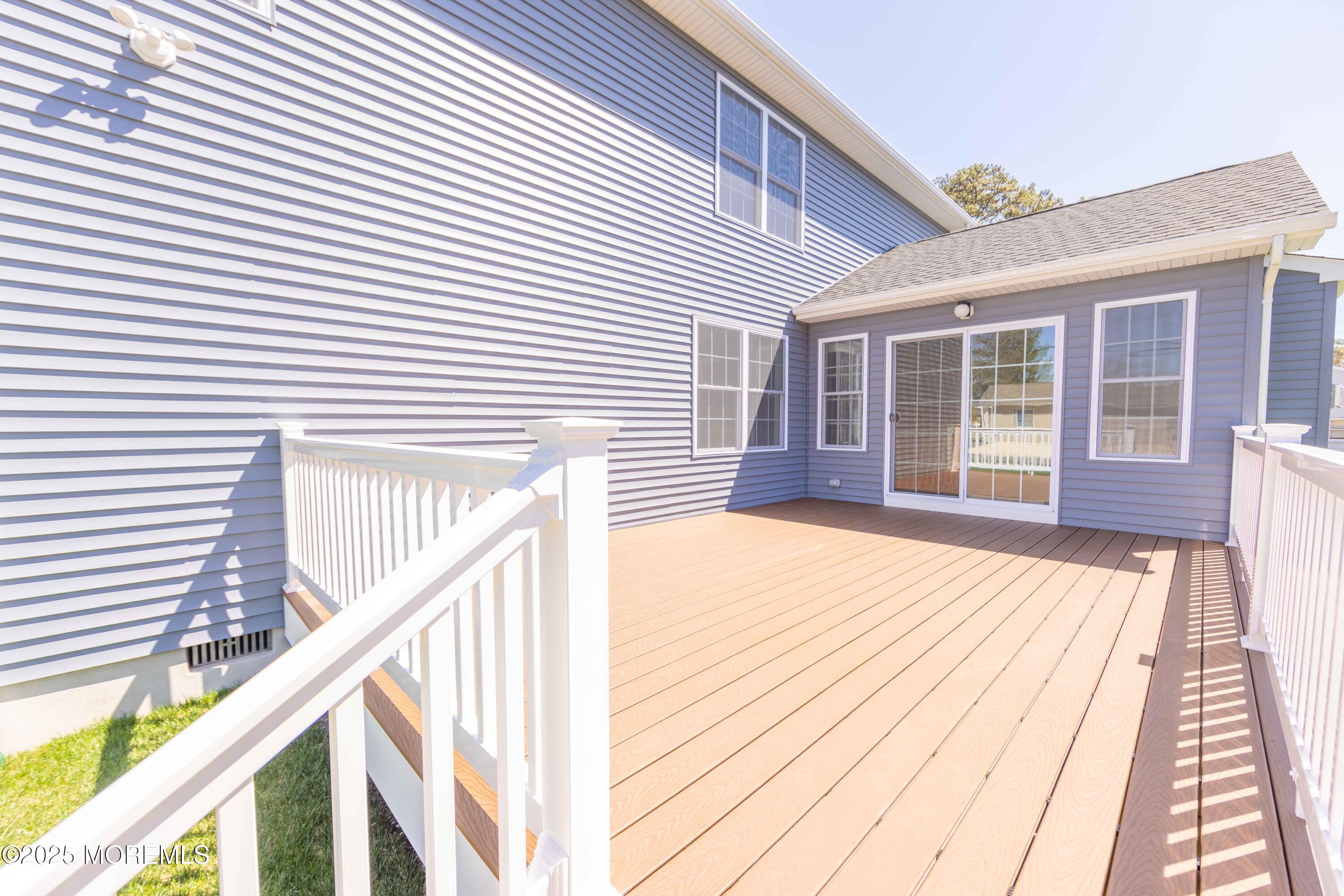 1517 Whitcomb Road Forked River, NJ 08731 - Photo 16 of 18 a view of a house with wooden deck