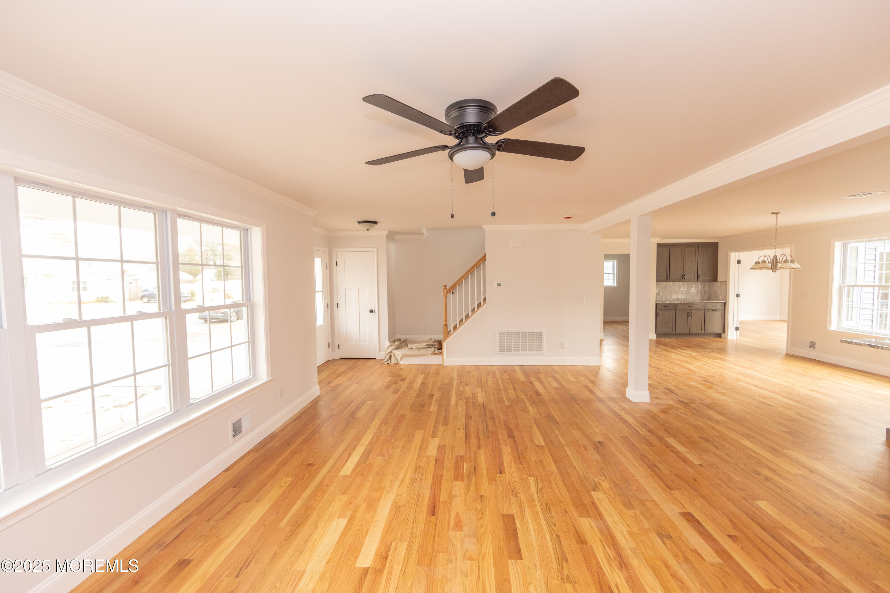 1517 Whitcomb Road Forked River, NJ 08731 - Photo 2 of 18 a view of an empty room with wooden floor and a window