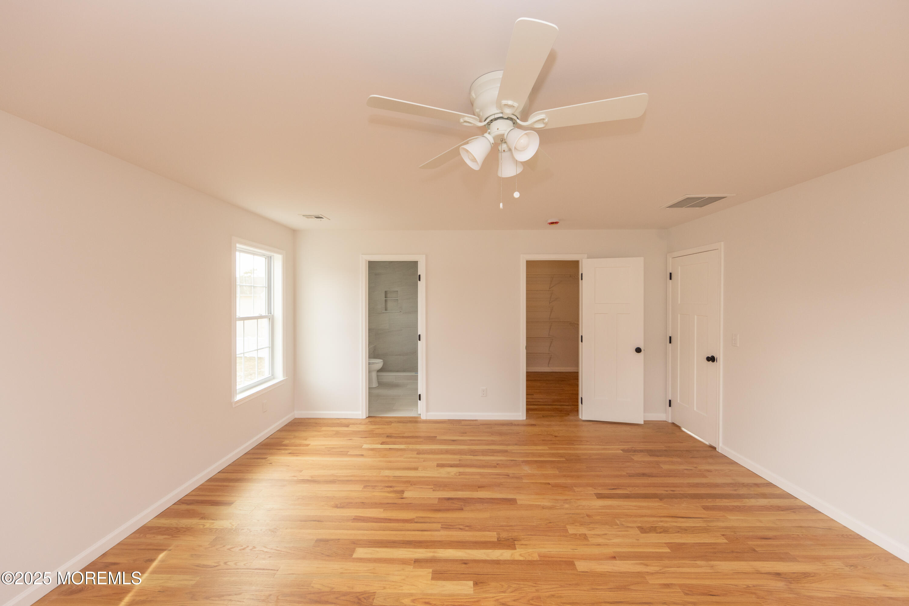 1517 Whitcomb Road Forked River, NJ 08731 - Photo 9 of 18 a view of empty room with window and ceiling fan