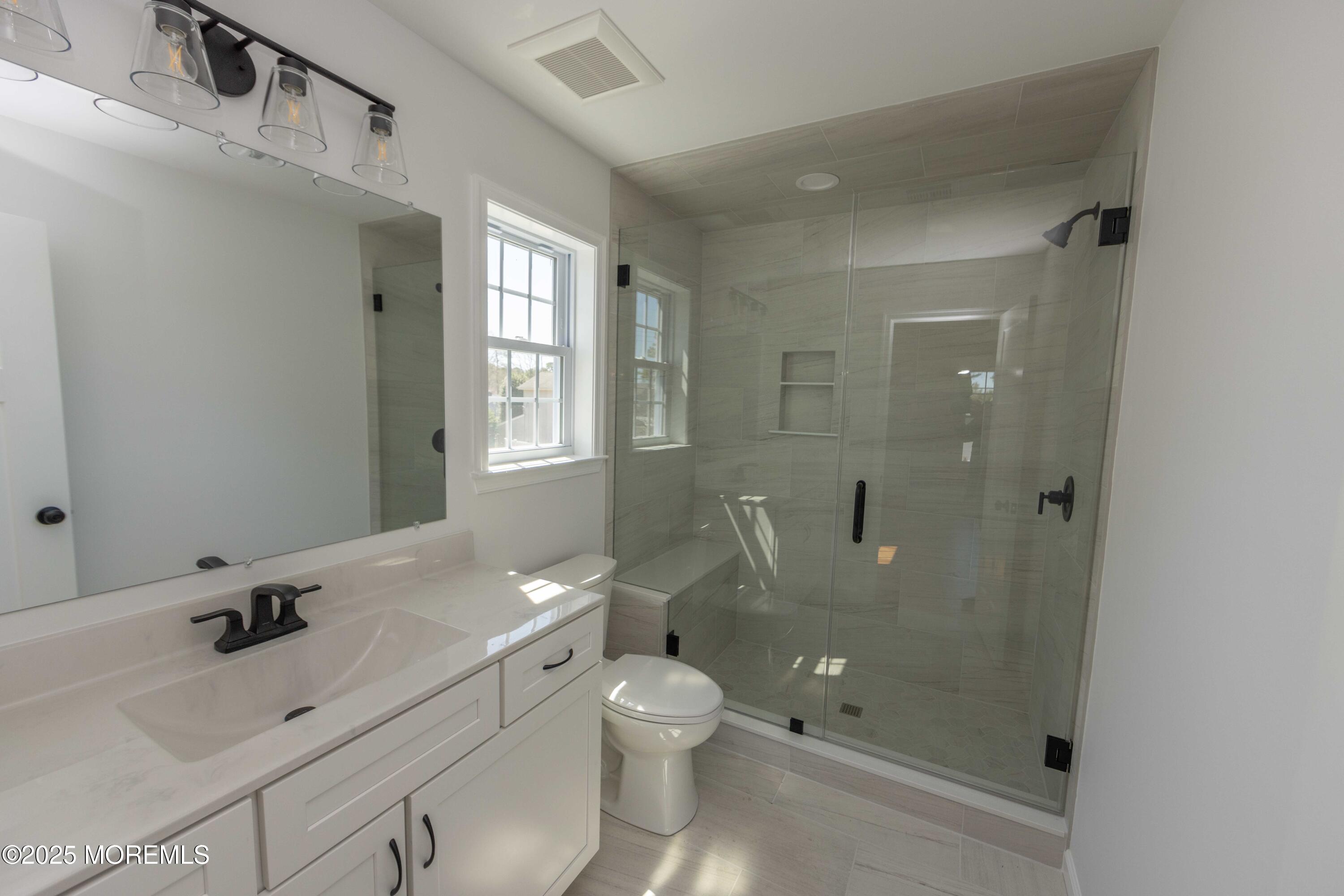 1517 Whitcomb Road Forked River, NJ 08731 - Photo 10 of 18 a bathroom with a sink a toilet and shower