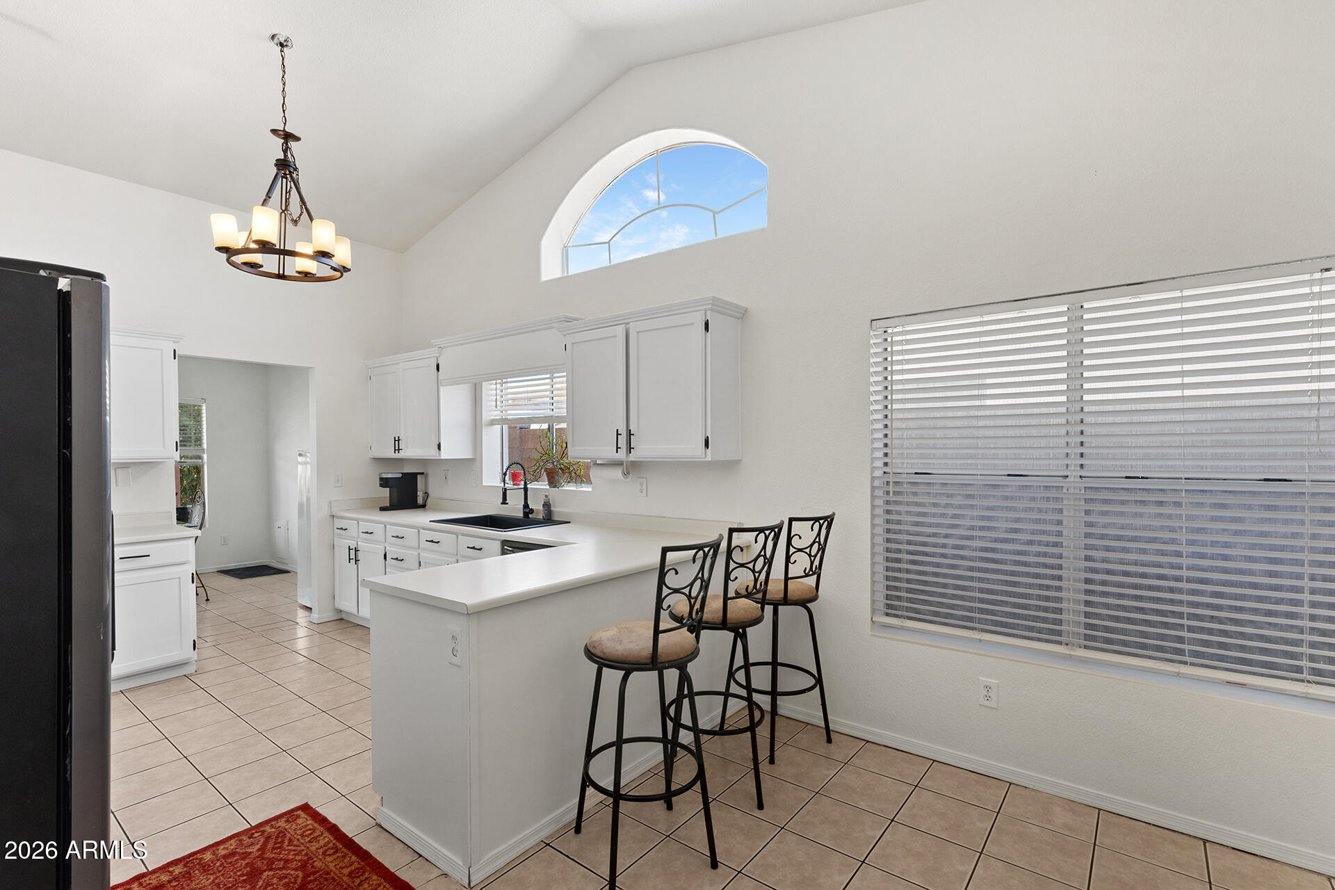 9002 West Coronado Road Phoenix, AZ 85037 - Photo 14 of 54 a view of a dining room kitchen and a window