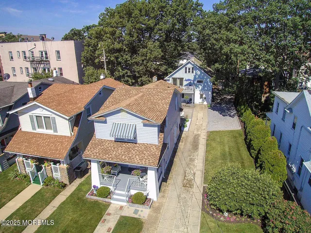a view of a house with palm trees