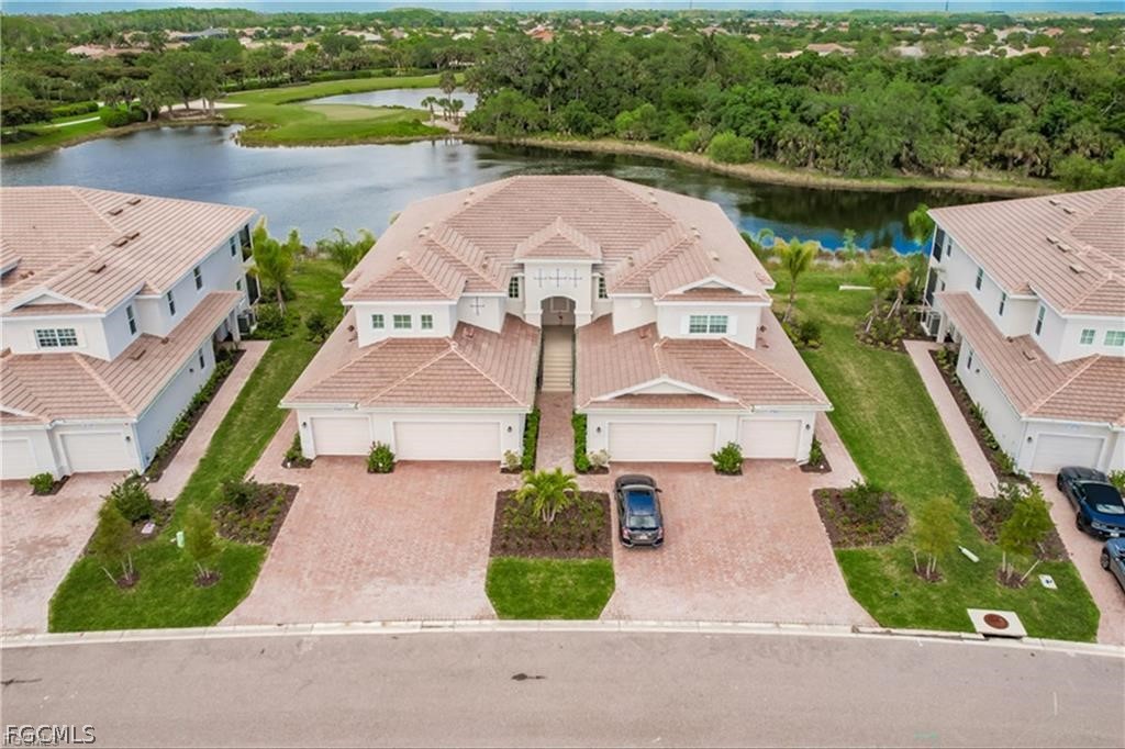 an aerial view of a house with a yard and balcony