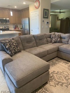 3740 Pebblebrook Ridge Court, Unit 102 Fort Myers, FL 33905 - Photo 12 of 46 a living room with furniture and a kitchen