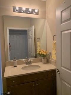 3740 Pebblebrook Ridge Court, Unit 102 Fort Myers, FL 33905 - Photo 15 of 46 a bathroom with a sink double vanity and a mirror