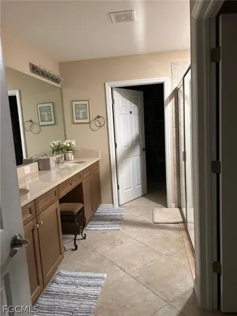 a workspace with furniture and a bathroom