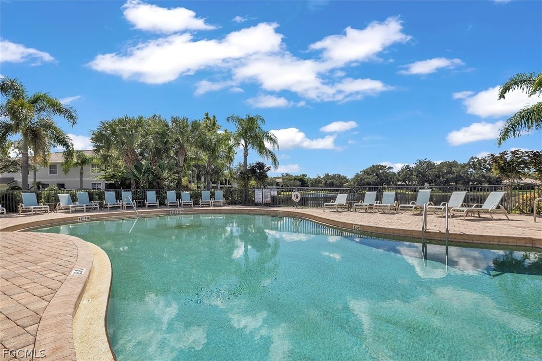 3740 Pebblebrook Ridge Court, Unit 102 Fort Myers, FL 33905 - Photo 41 of 46 a view of a swimming pool and a yard