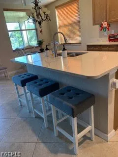 a kitchen with a sink a counter top space and appliances