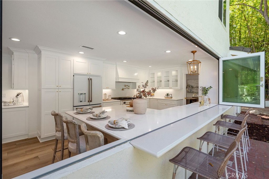 30050 Cielo Mesa Temecula, CA 92592 - Photo 14 of 43 a large kitchen with a table and chairs