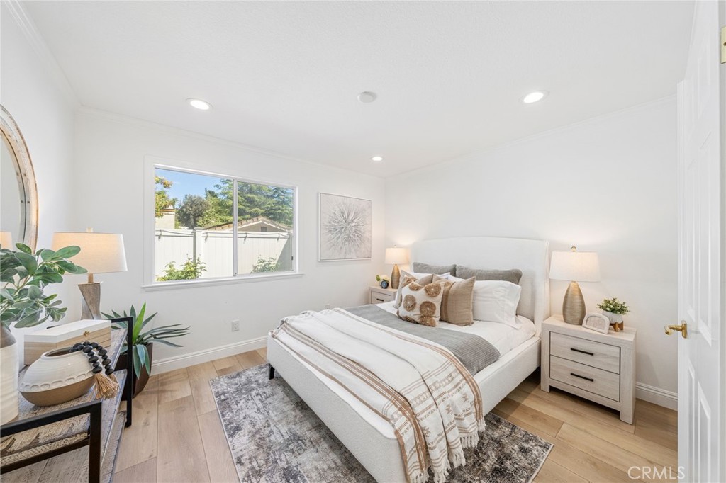 30050 Cielo Mesa Temecula, CA 92592 - Photo 18 of 43 a bedroom with a bed and a potted plant