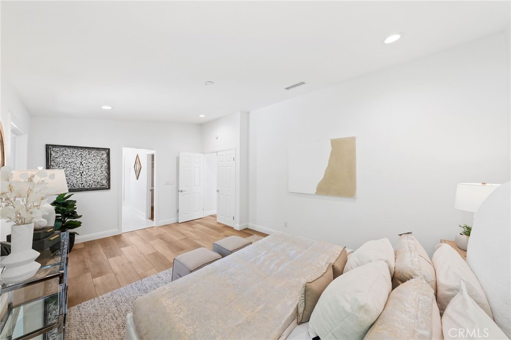 30050 Cielo Mesa Temecula, CA 92592 - Photo 28 of 43 a bedroom with a bed and a painting on the wall