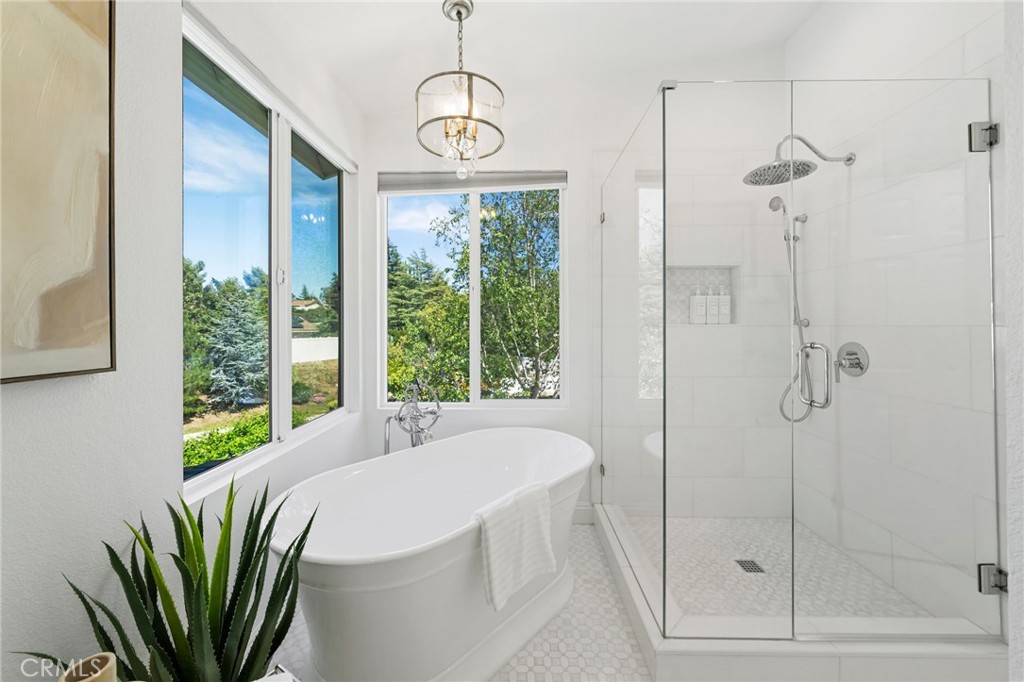 30050 Cielo Mesa Temecula, CA 92592 - Photo 30 of 43 a bathroom with a bathtub and a shower