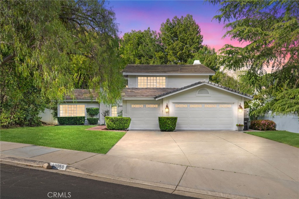 30050 Cielo Mesa Temecula, CA 92592 - Photo 3 of 43 a front view of a house with a yard and garage