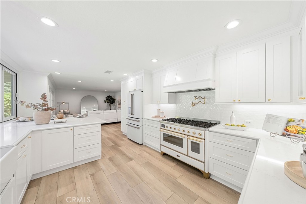 30050 Cielo Mesa Temecula, CA 92592 - Photo 9 of 43 a kitchen with white cabinets and appliances
