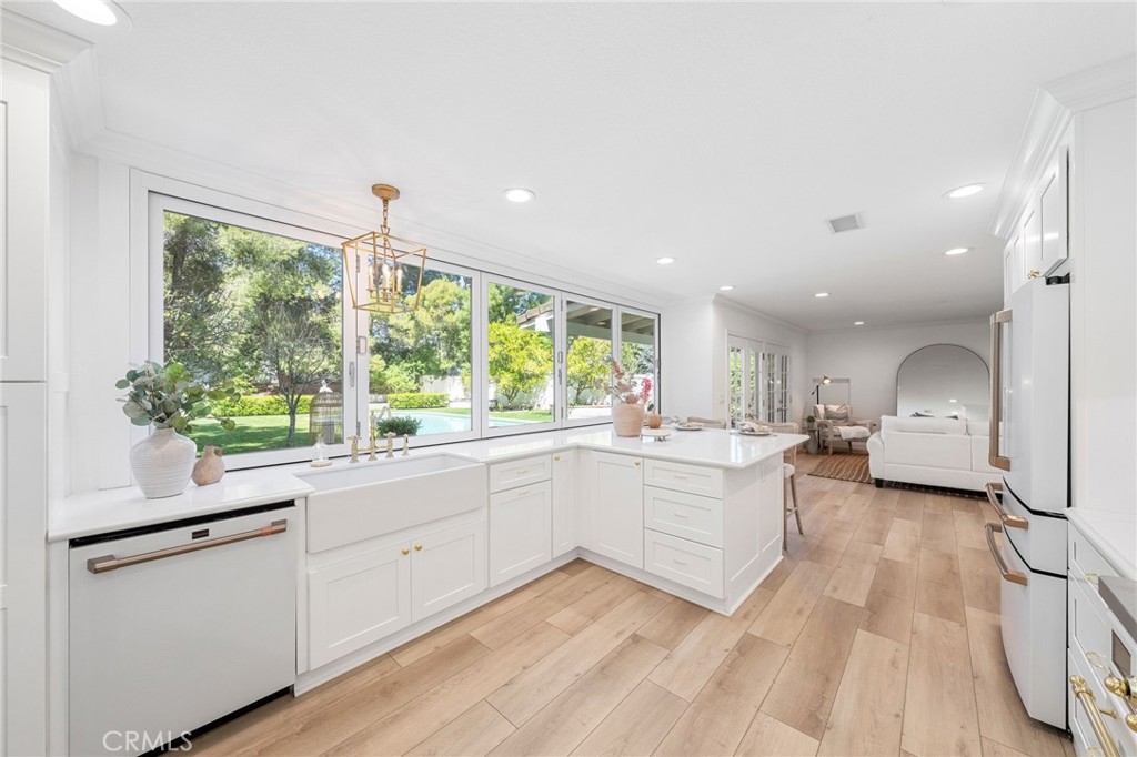 30050 Cielo Mesa Temecula, CA 92592 - Photo 10 of 43 a kitchen with sink cabinets and outdoor view