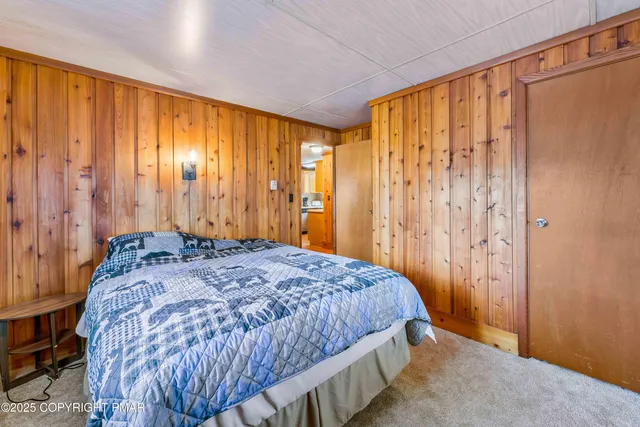 a view of a house with a yard covered in snow