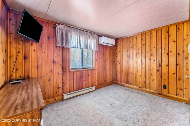 a blue and white house with a large window