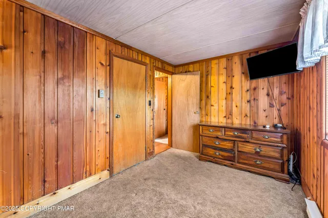 a green field with trees in the background