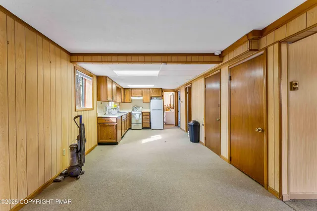 a front view of a house with parking area