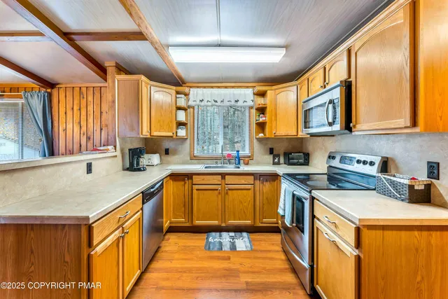 a bathroom with a sink mirror vanity and toilet