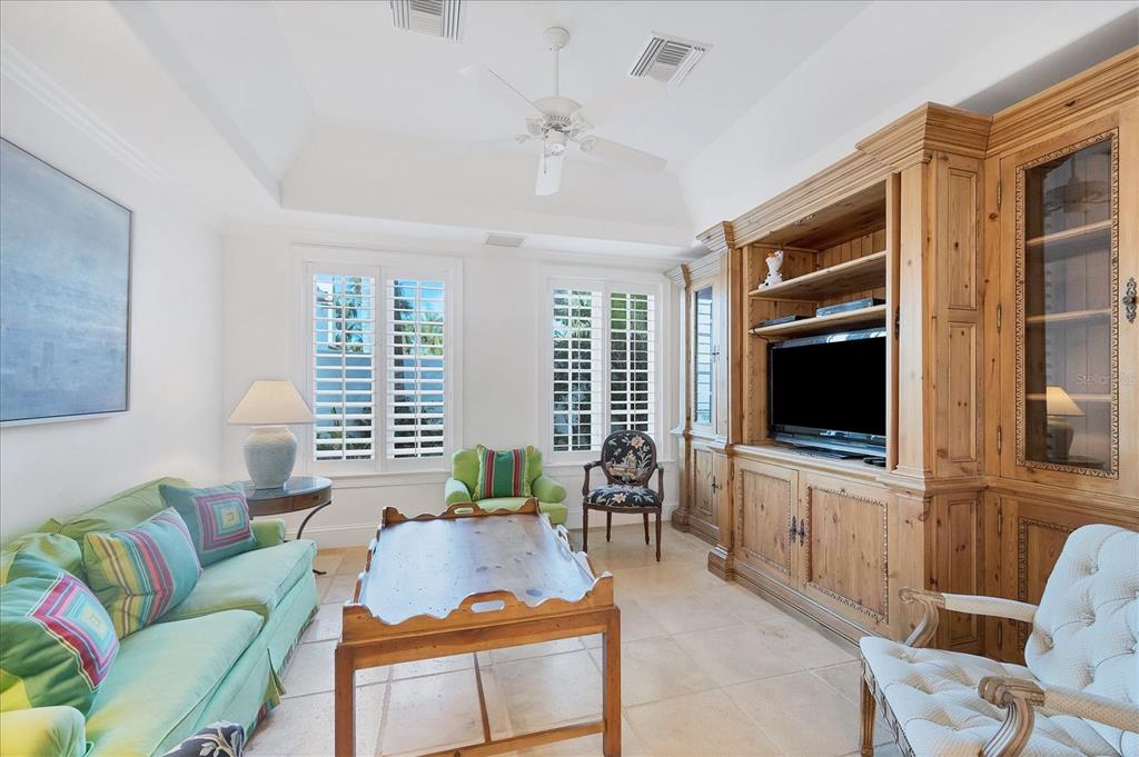 1031 10th Street West Boca Grande, FL 33921 - Photo 17 of 45 a living room with furniture and a flat screen tv