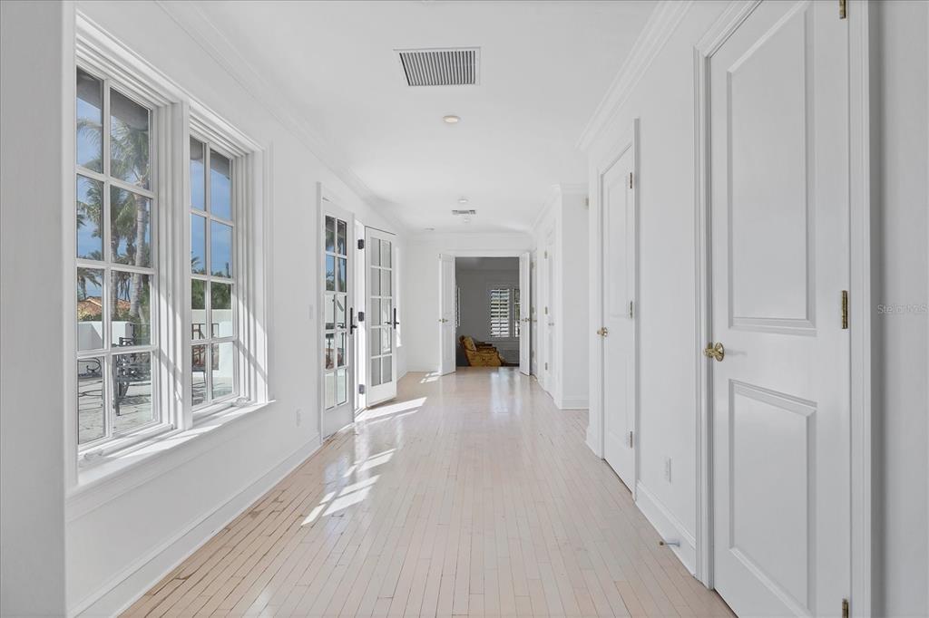 1031 10th Street West Boca Grande, FL 33921 - Photo 22 of 45 a view of a hallway with wooden floor and windows