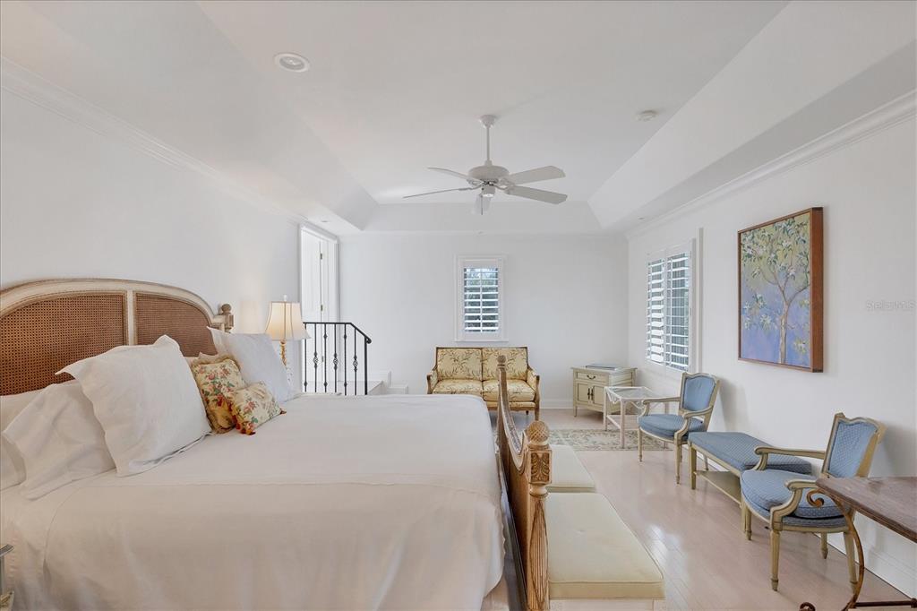 1031 10th Street West Boca Grande, FL 33921 - Photo 25 of 45 a bedroom with a bed a couch and dresser