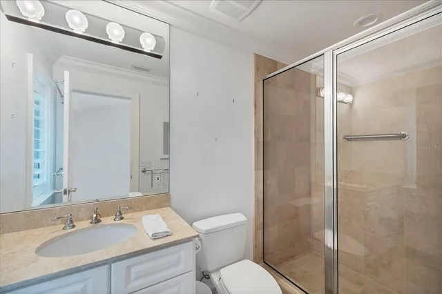a bathroom with a sink toilet and mirror