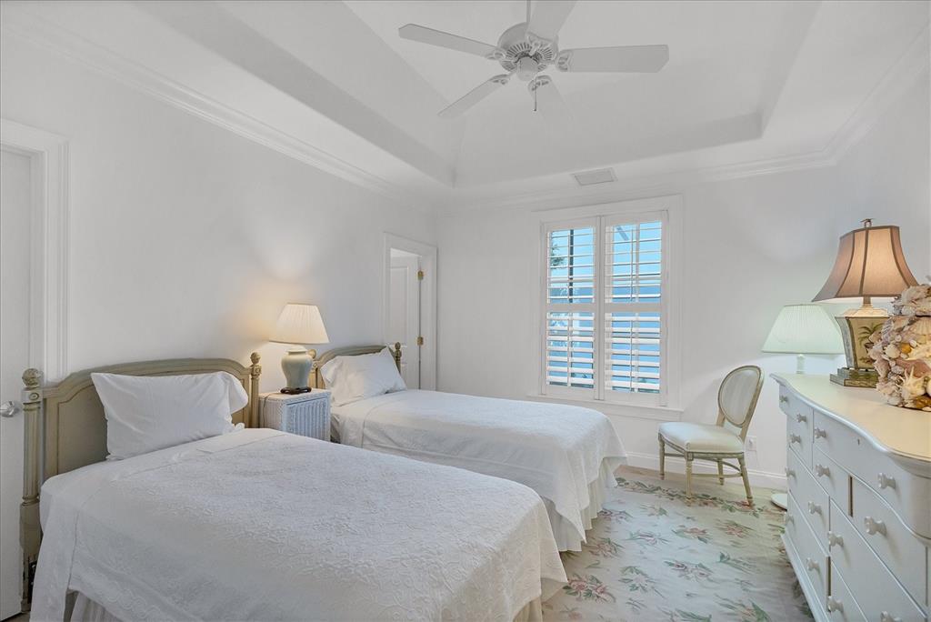 1031 10th Street West Boca Grande, FL 33921 - Photo 29 of 45 a bedroom with two beds and a window