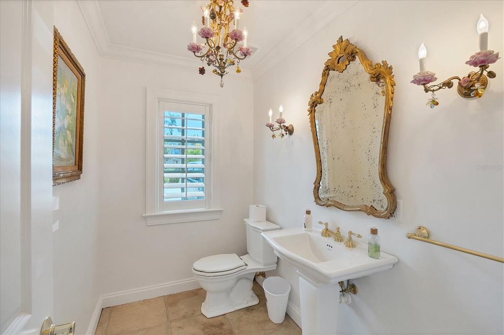 1031 10th Street West Boca Grande, FL 33921 - Photo 31 of 45 a bathroom with a sink toilet and mirror