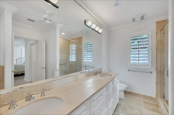 a bathroom with a shower and a sink