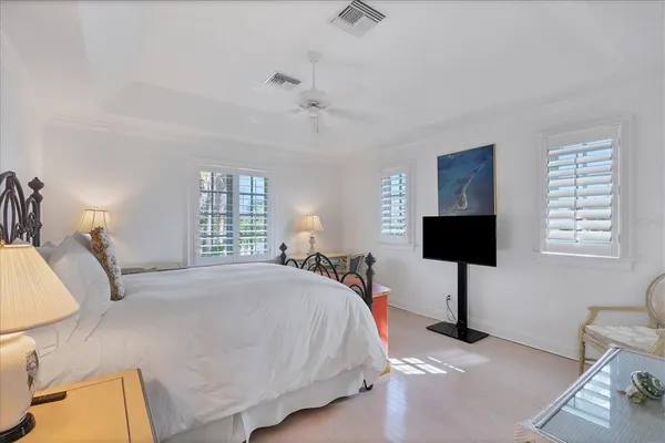 a view of a backyard with a garden and palm trees