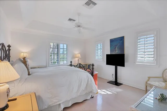 a view of a backyard with a garden and palm trees