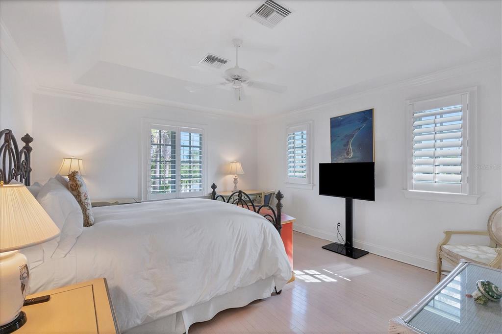 1031 10th Street West Boca Grande, FL 33921 - Photo 34 of 45 a bedroom with a bed and a flat screen tv