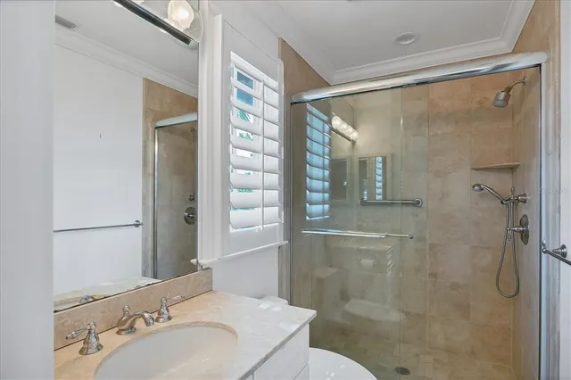 a view of a patio with a table and chairs