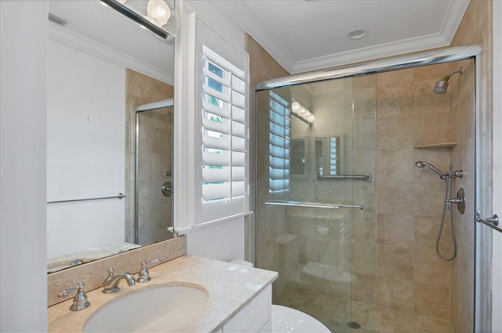 1031 10th Street West Boca Grande, FL 33921 - Photo 35 of 45 a bathroom with a shower and a sink