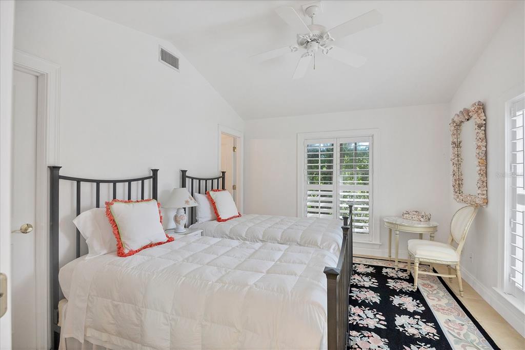 1031 10th Street West Boca Grande, FL 33921 - Photo 36 of 45 a bedroom with a bed and a window