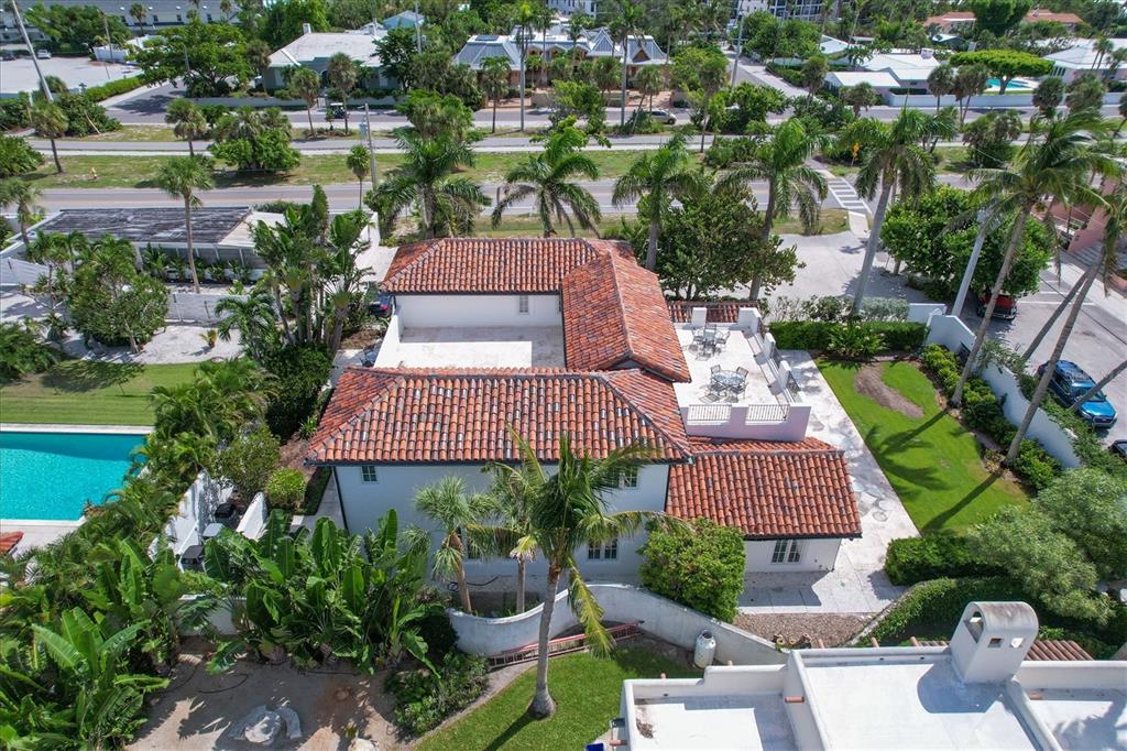 1031 10th Street West Boca Grande, FL 33921 - Photo 6 of 45 an aerial view of a house with garden space and lake view
