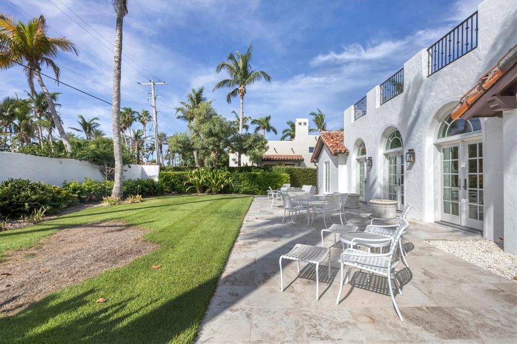 1031 10th Street West Boca Grande, FL 33921 - Photo 10 of 45 a view of a patio with a table and chairs